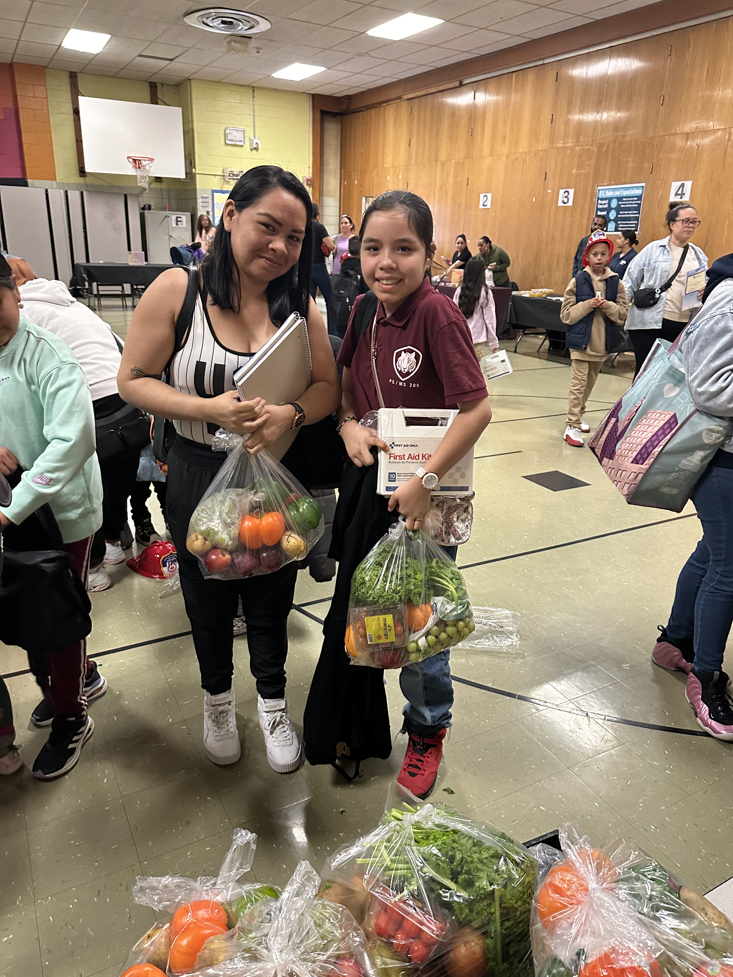 Happy family receiving fresh produce