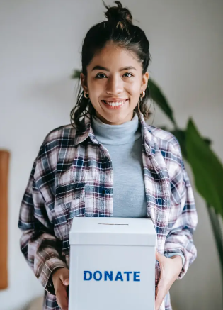 Girl holding donations box